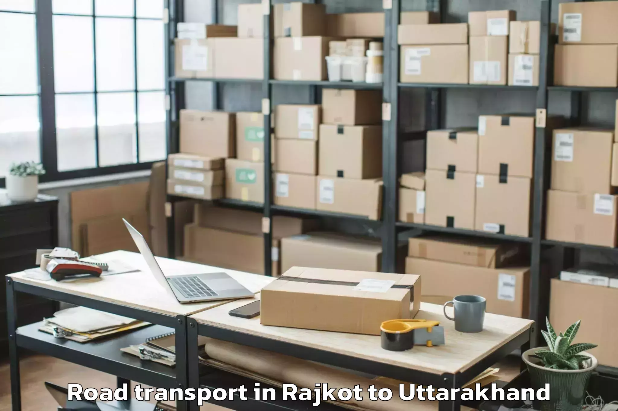 Book Rajkot to Graphic Era Hill University Cl Road Transport Online